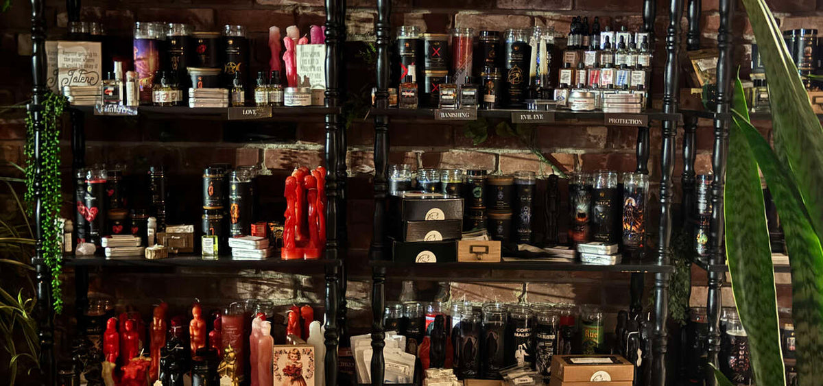 Ritual candles and supplies displayed on Moonbow’s shelves