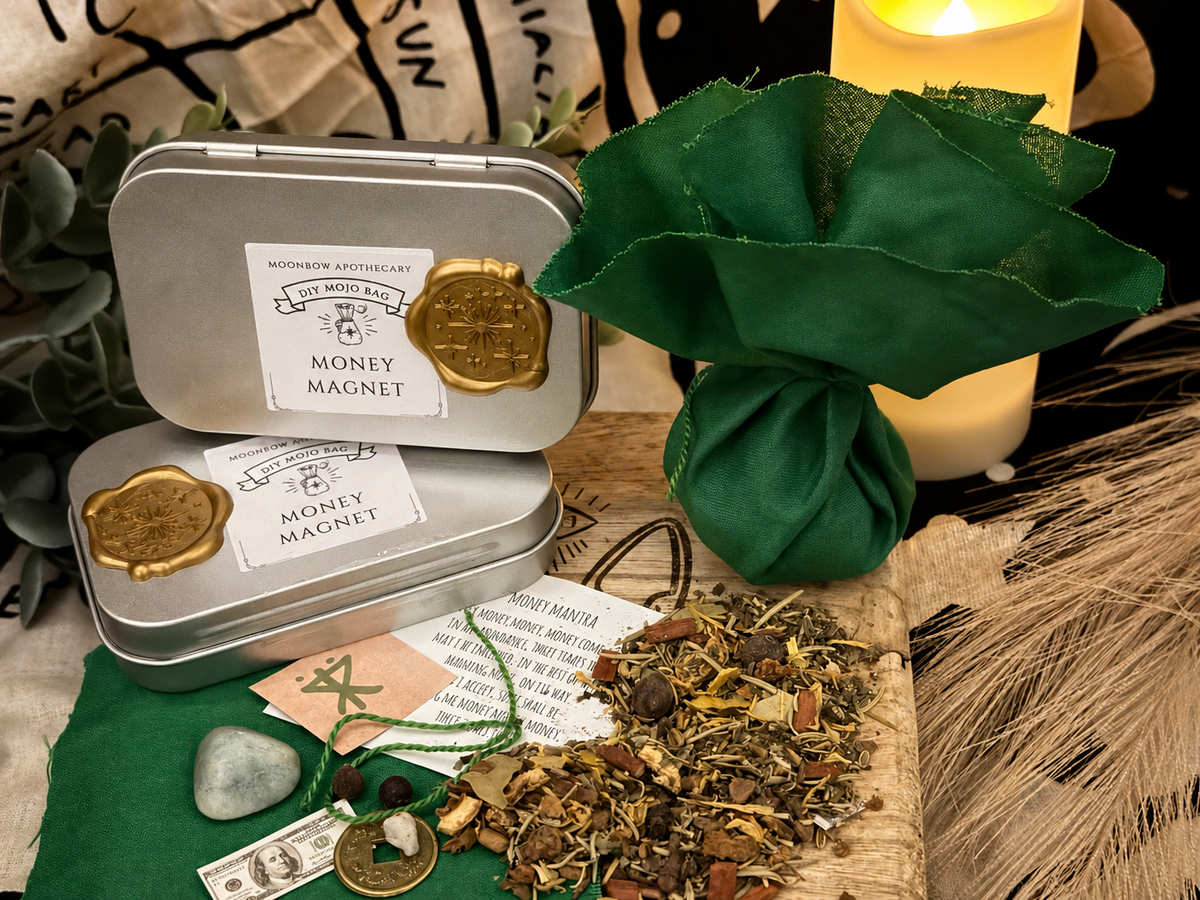 DIY Mojo Bag Money Magnet lifestyle photo with green mojo bag, herbs, and candle