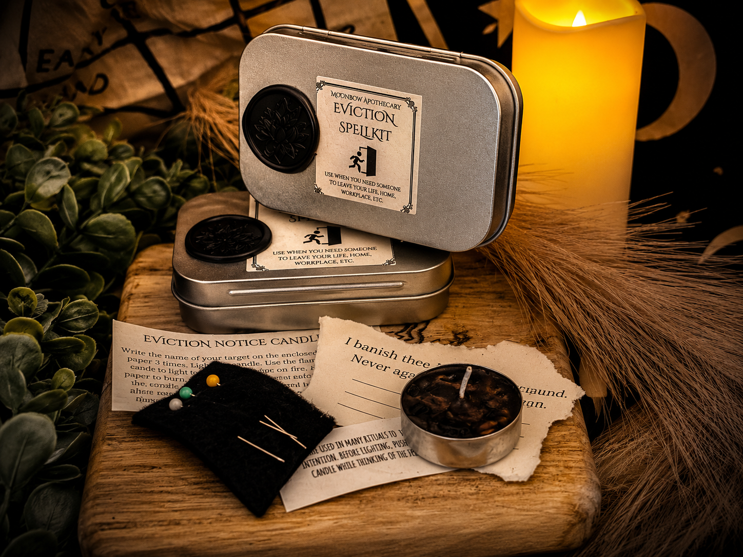 Eviction Spell Kit lifestyle photo with black mojo bag, candle, and ritual items