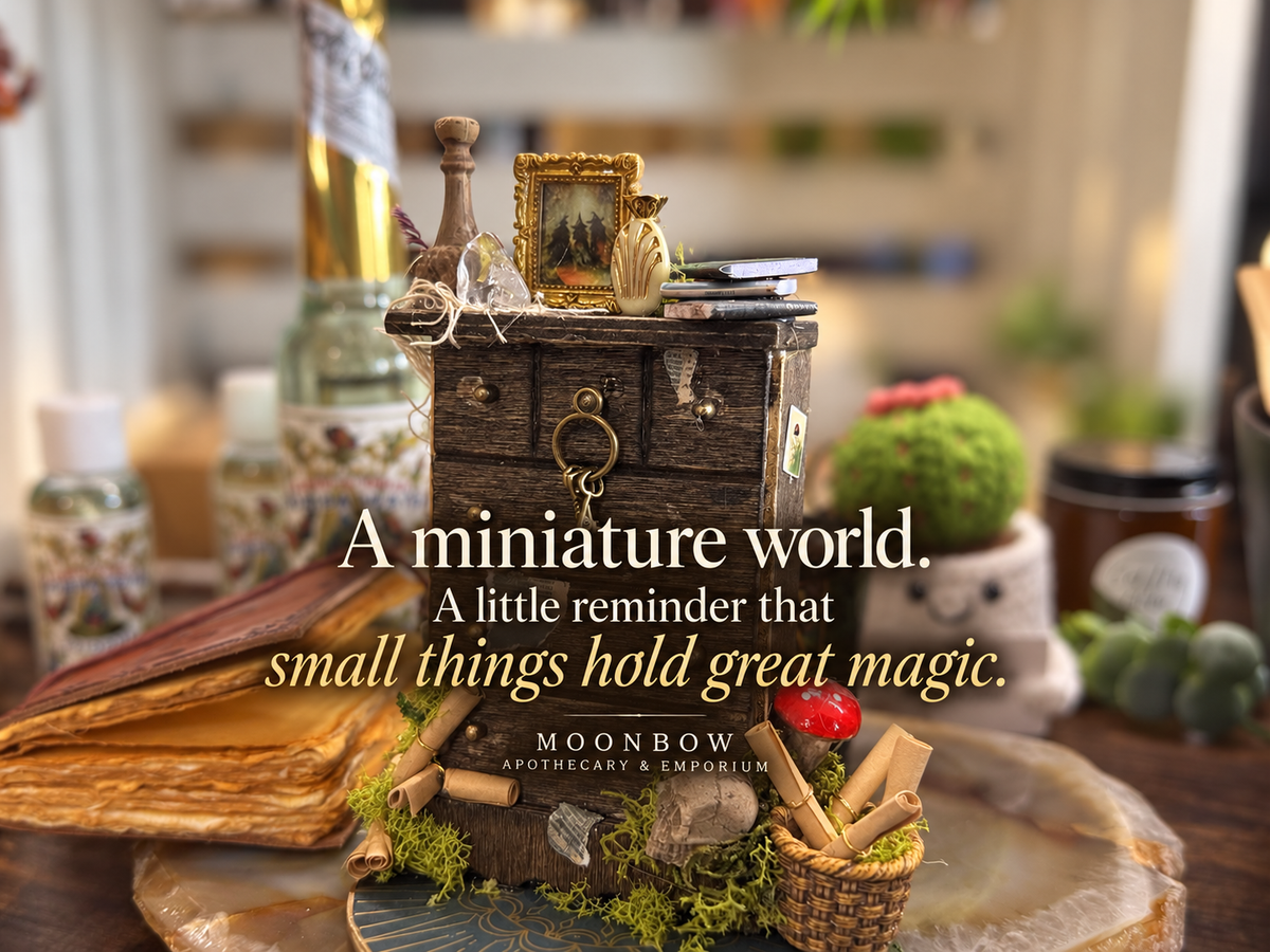 A miniature world displayed among plants and curios at Moonbow