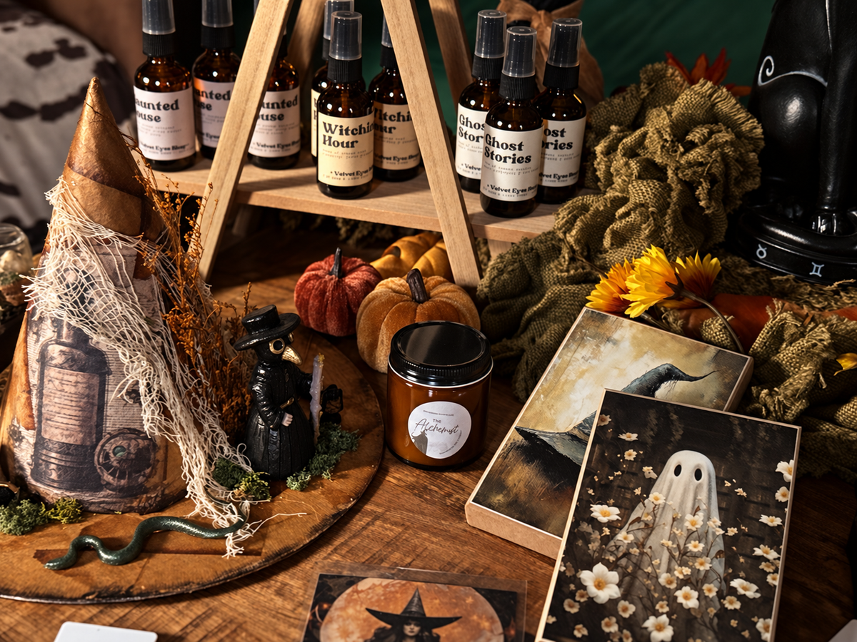 Ritual tools, candles, and curios on a Moonbow display